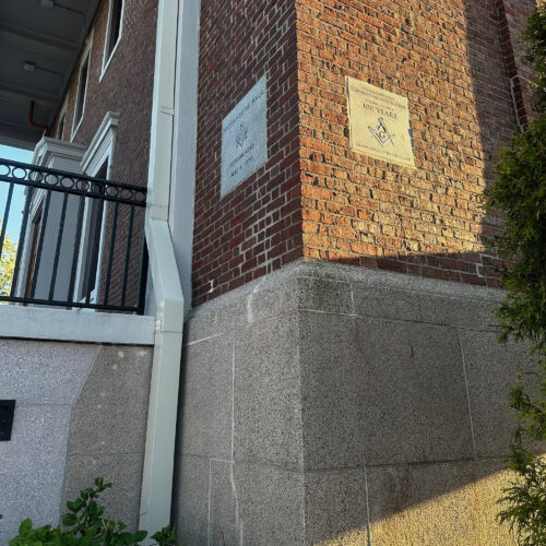 A perspective shot of the Northeastern corner of a Masonic Building. A rededication cornerstone carve and installed.