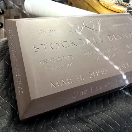 Flush Marker with a large chamfer cut on the edges. Lots of letters carved.