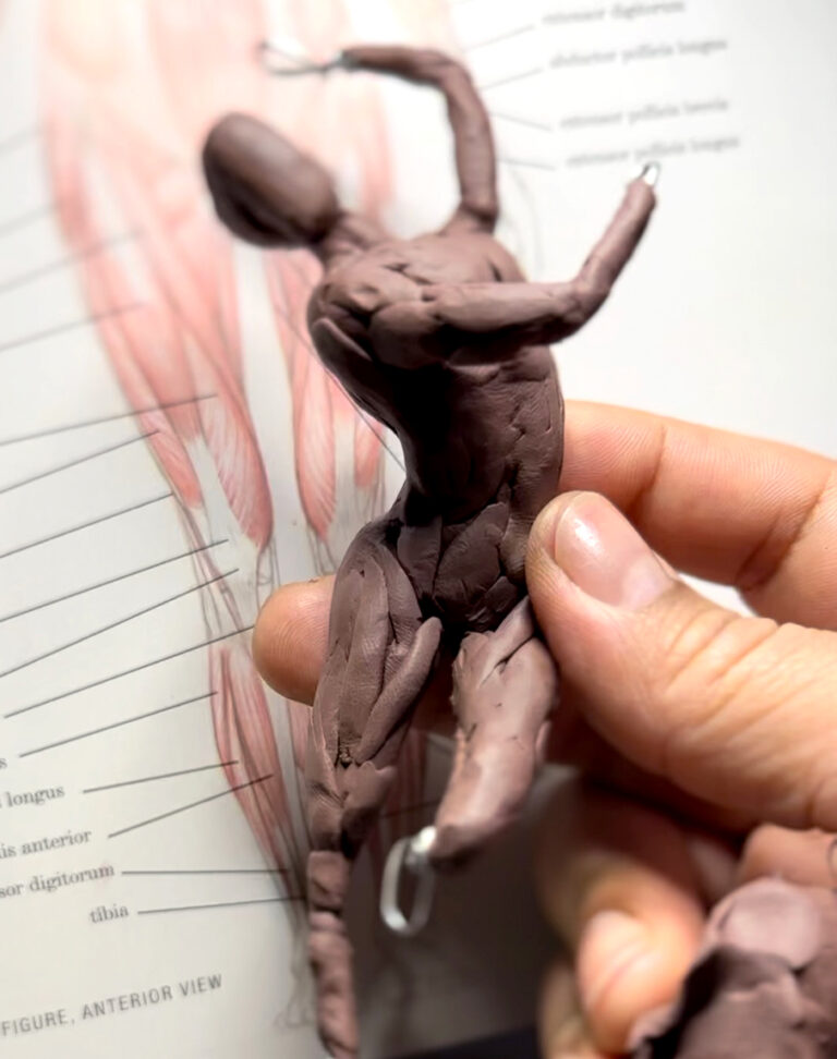 Small oil-based clay figure sculpted to be casted in bronze.