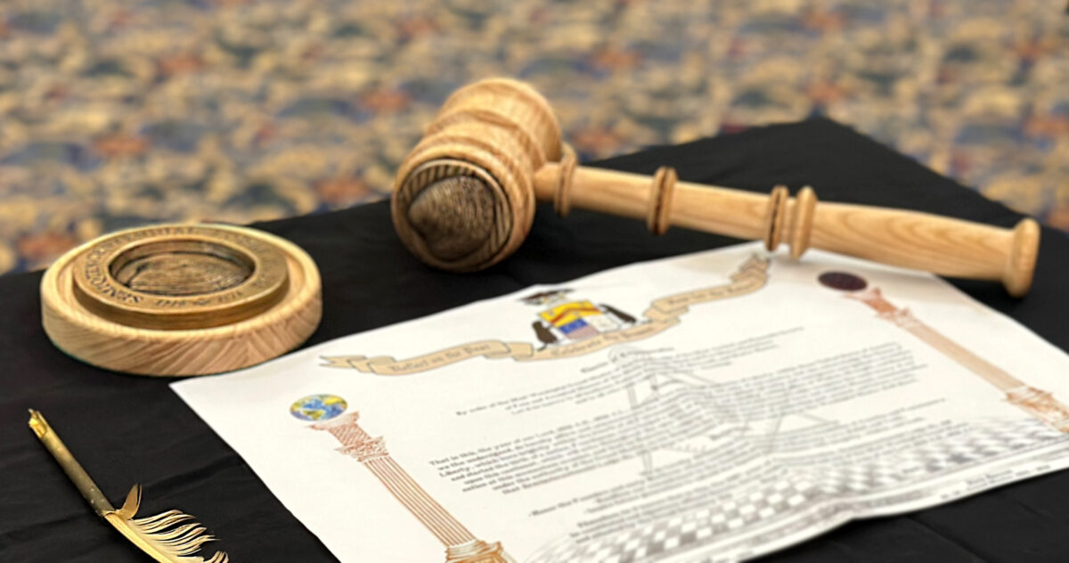 A composite shot of a full masonic Gavel Set with a bronze top crown and a bronze striker.
